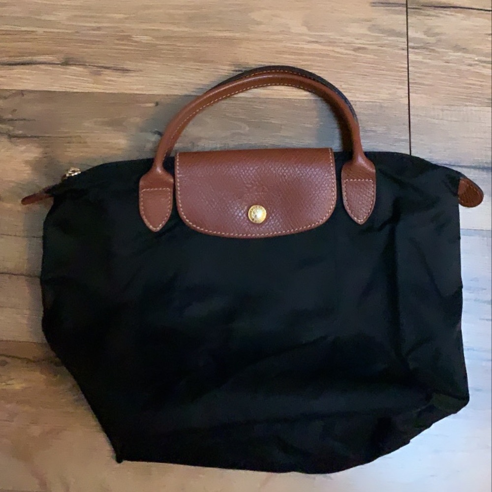 Long champ small top handle bag